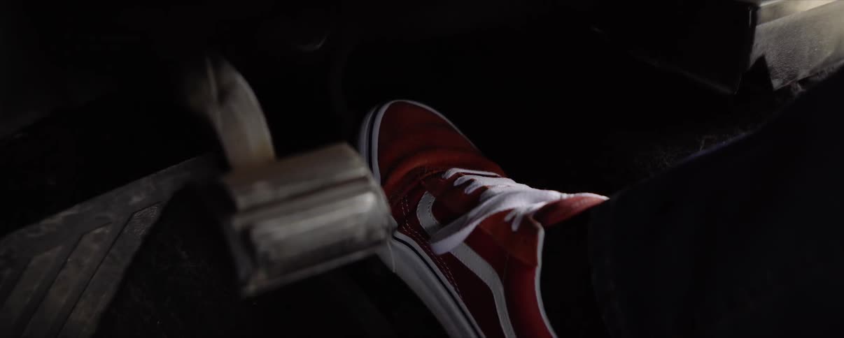 pushing gas pedal in classic car