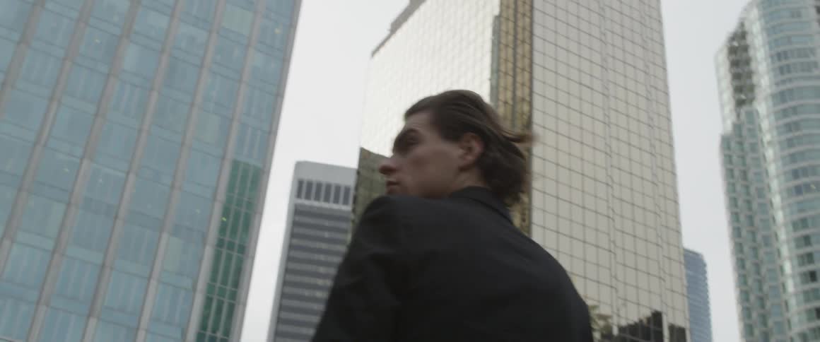 Man Walking Around City