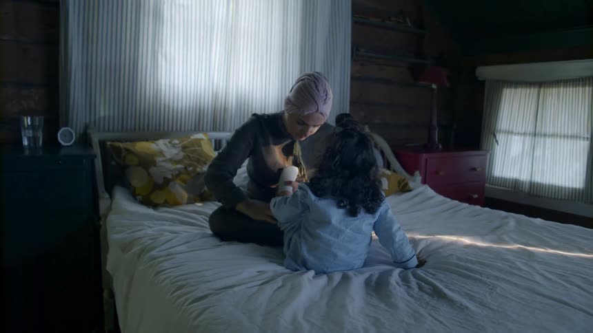 A mother tends to a toddler
