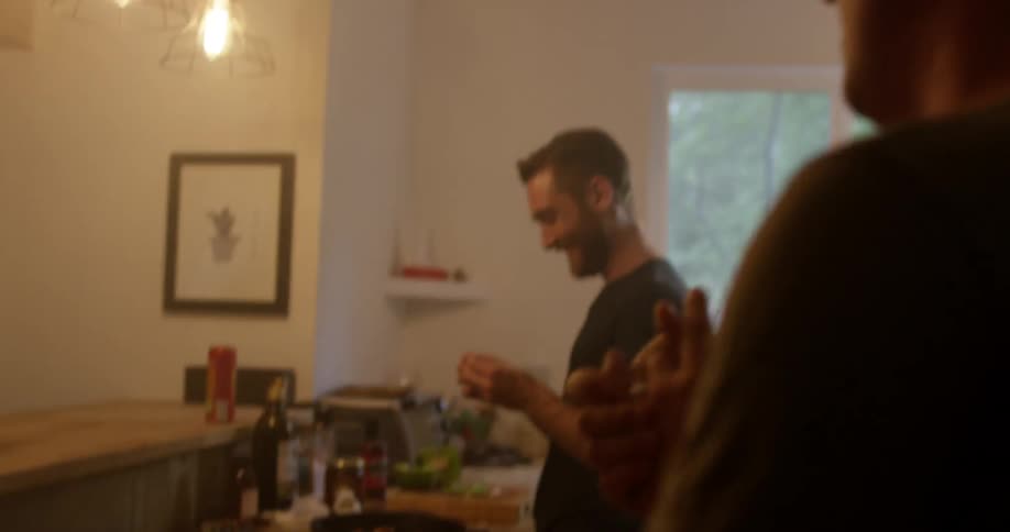 A group of people gathered in a kitchen