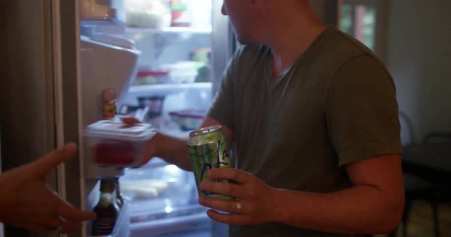 A group of people preparing dish at home