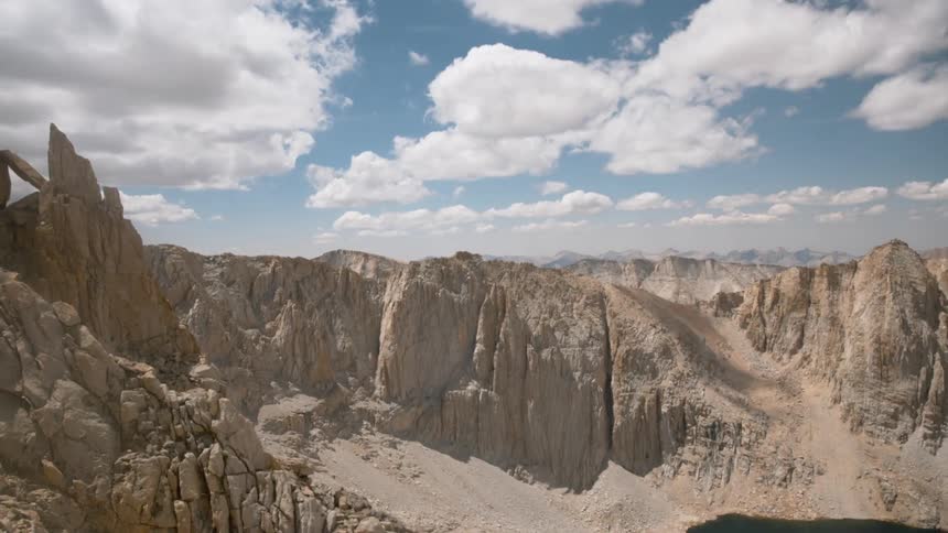 View of a large cavern with rock mountains all around