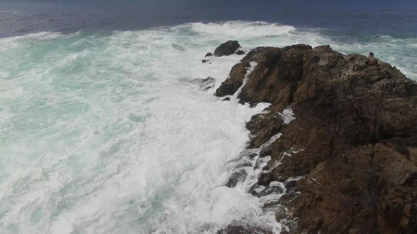 Waves crashing against rocks