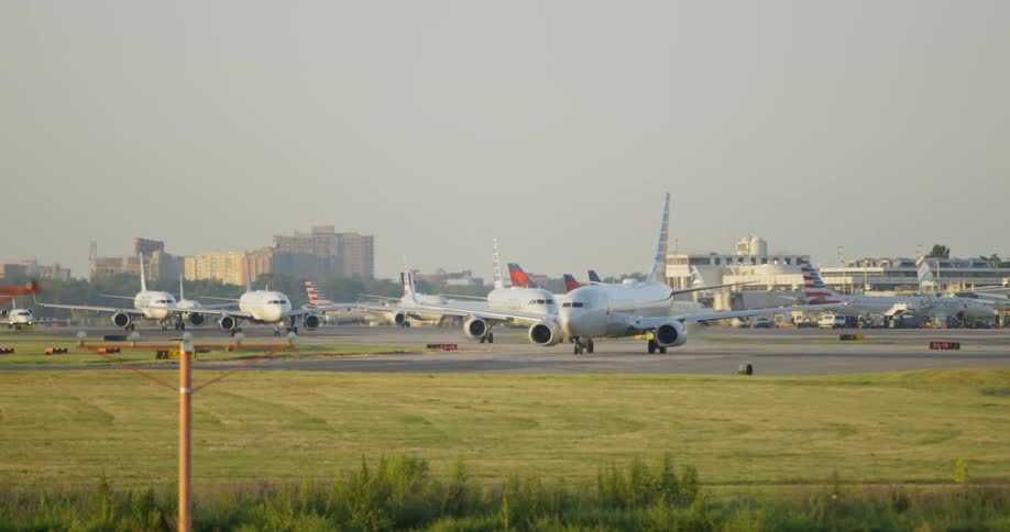 Airplanes are landing outdoors