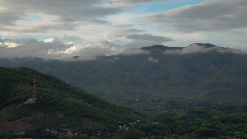 Clouds passing over mountains