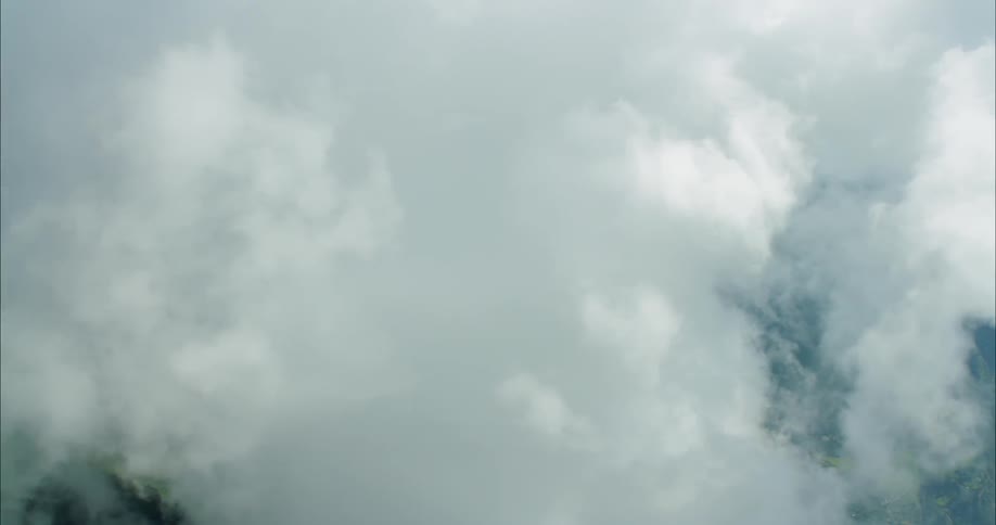 Clouds float over mountain tops