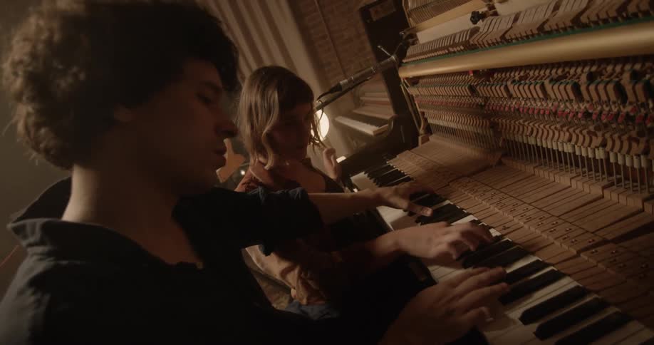 People Playing Music In Studio