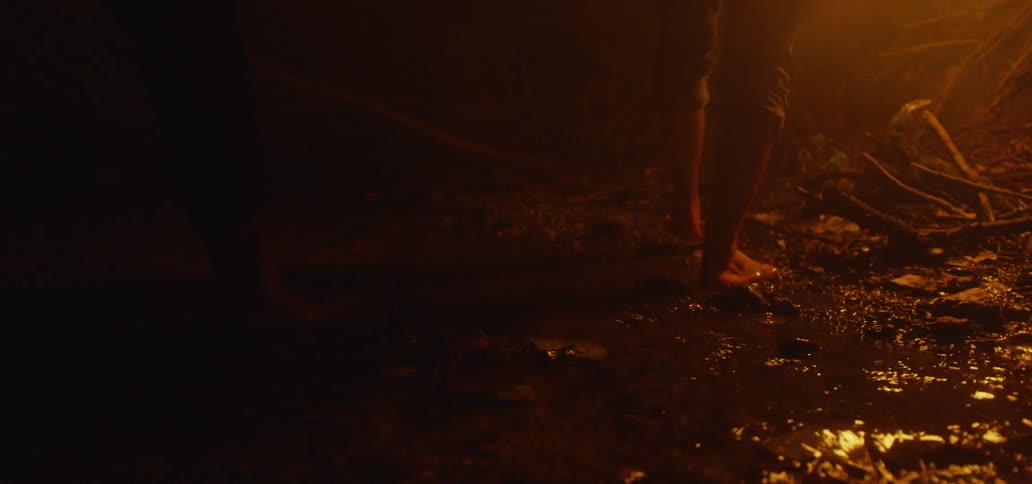 Two People Walking In A Creek