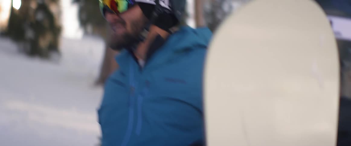 Snowboarders talking and laughing