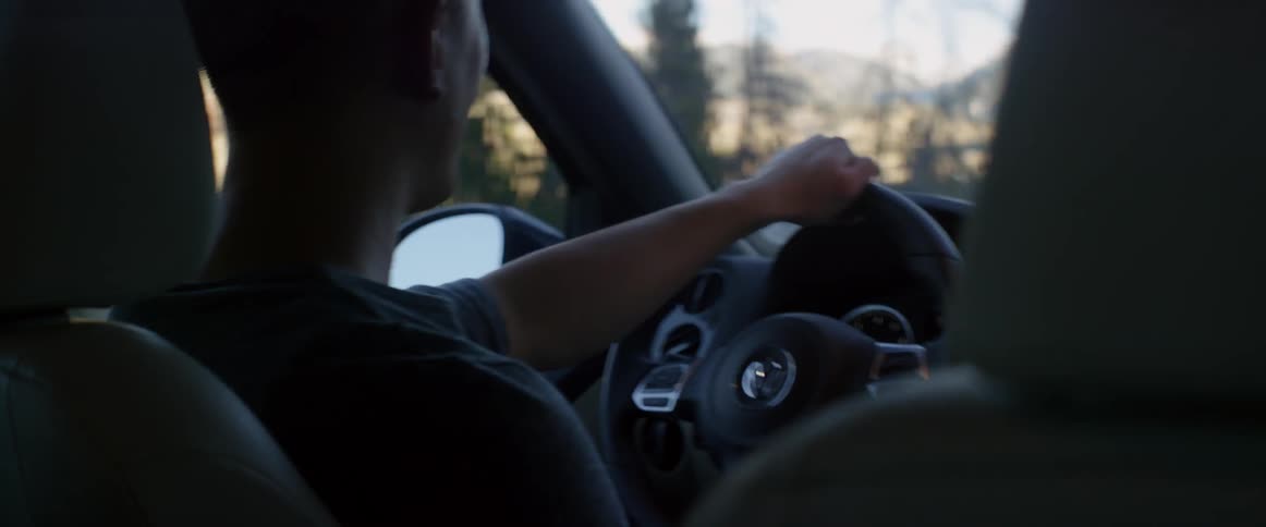 Man drives a car on a clear day