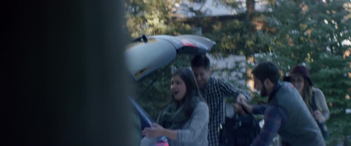 People unloading a car
