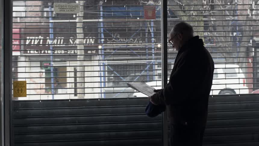 A person reading a newspaper