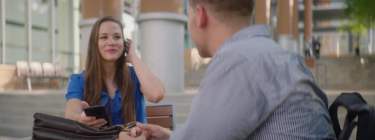 A man and a woman talking casually