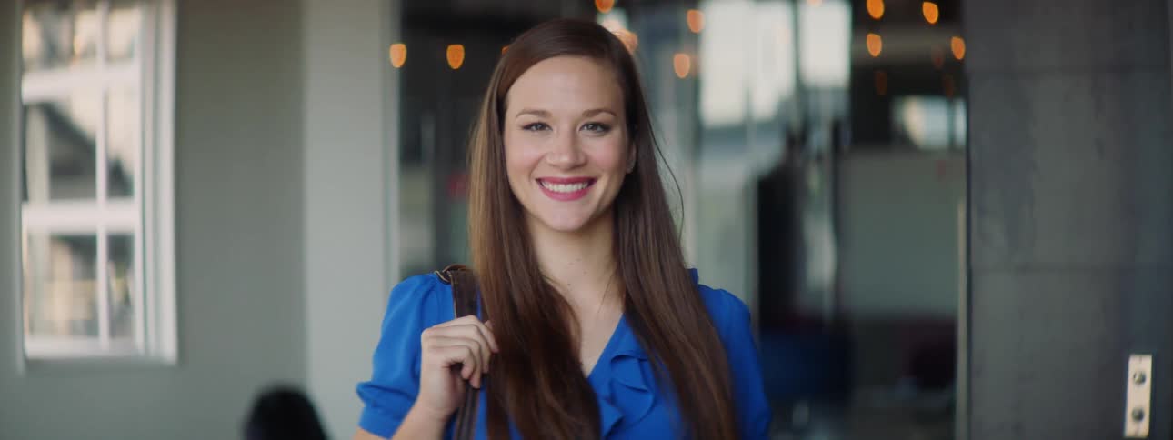 A woman smiling at the camera