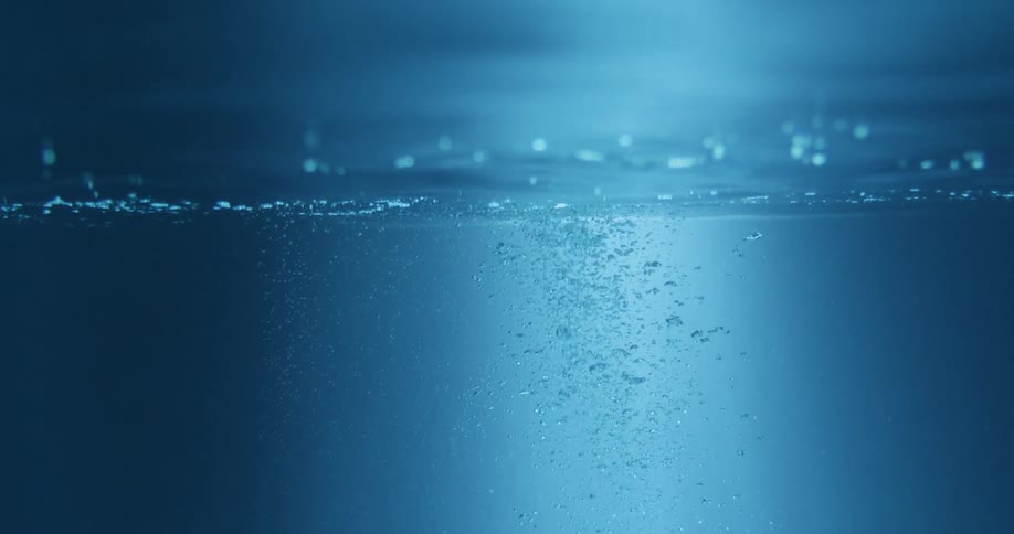 Air bubbles rising from underwater