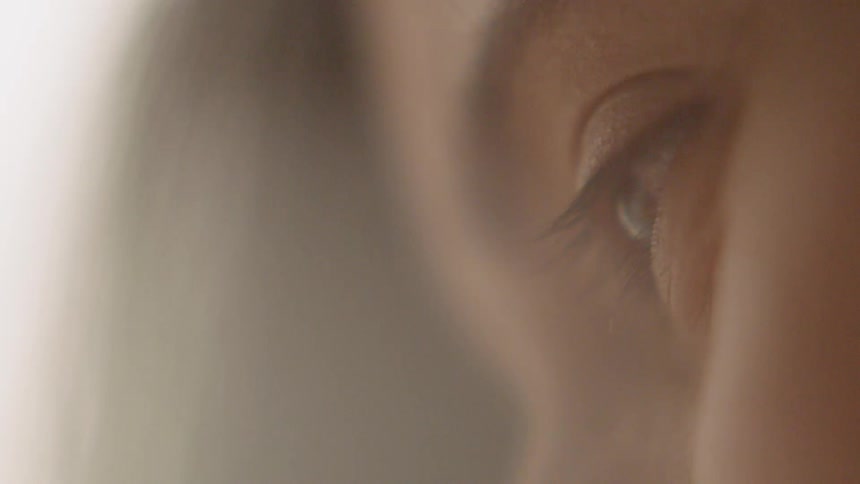 A woman looking and blinking