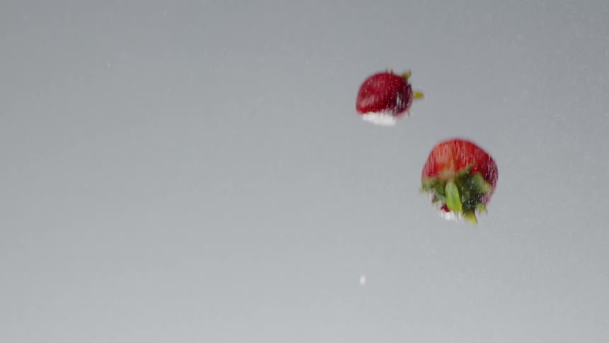 Many strawberries fall downward