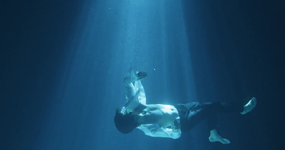 Man Floating Underwater