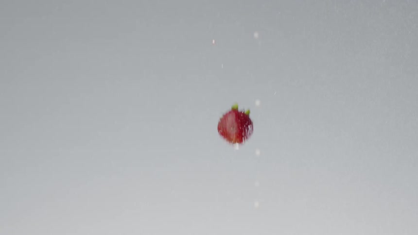 Strawberries falling from the top