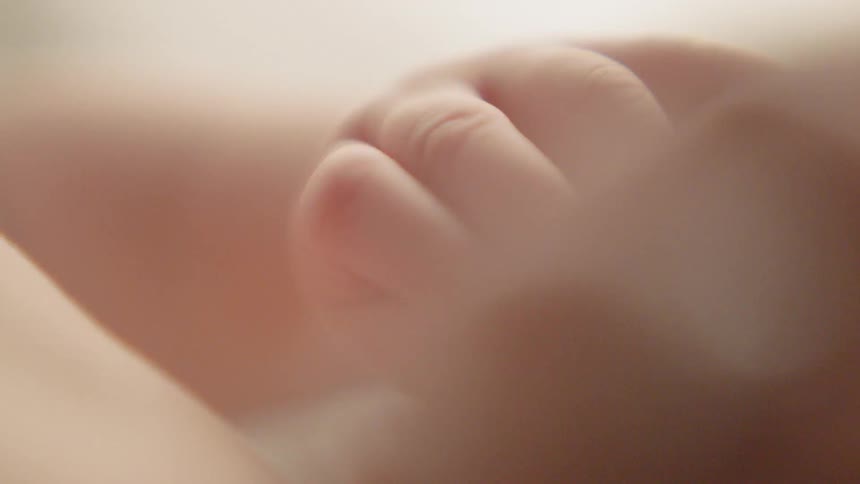 A baby hand moving around