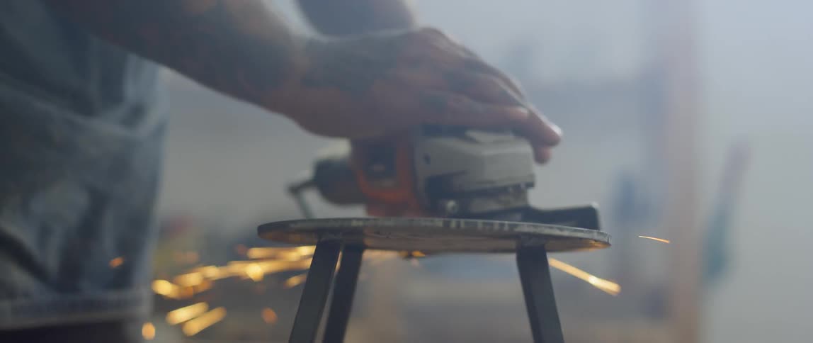 A man using a grinder