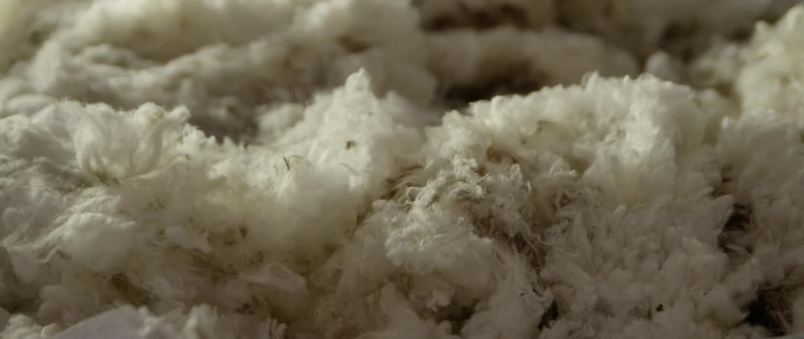 Pieces of wool or yarn fall into the pile