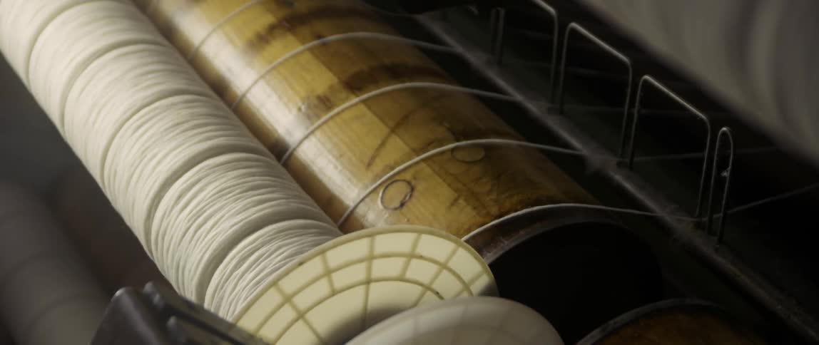 Wool is being spun onto a wheel