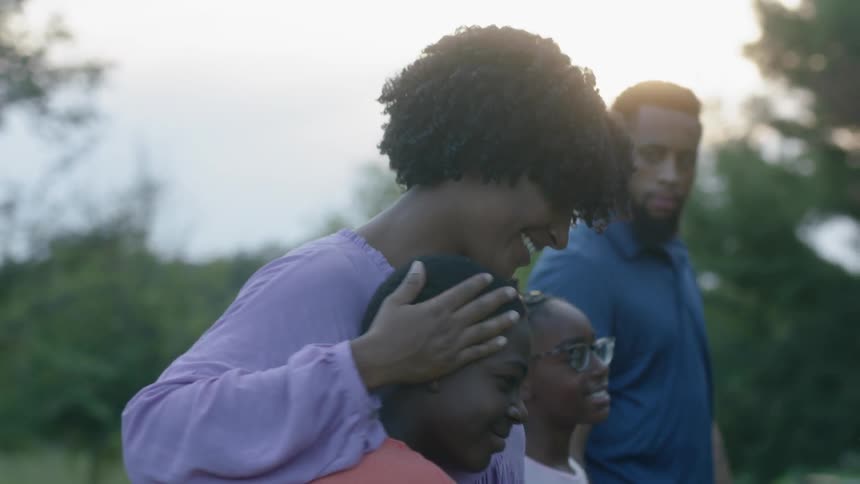 A family walks together outside
