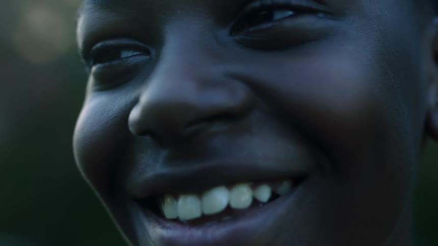 A boy with a big grin on his face