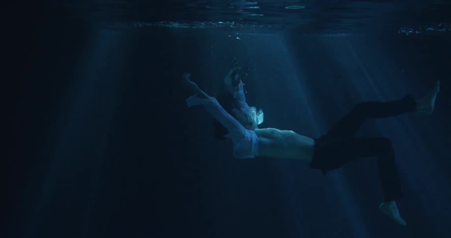 A person falling underwater