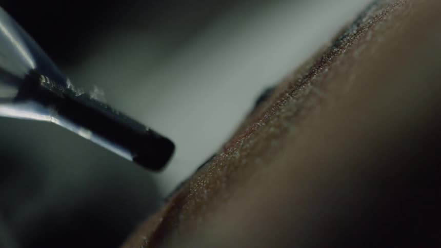 A hand being tattooed