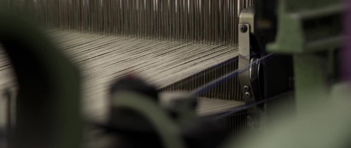 Thread moves through a loom