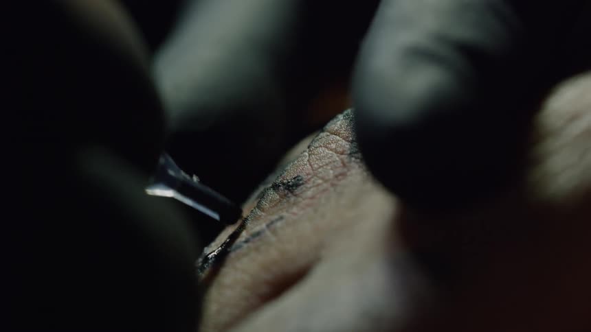 A hand being tattooed