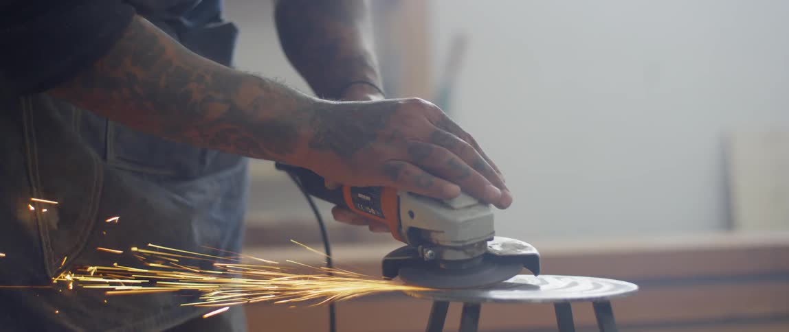 A man using a grinder