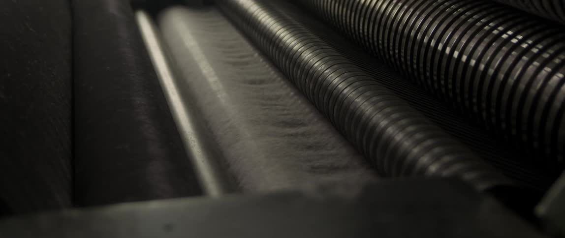 Thread is fed through an industrial machine