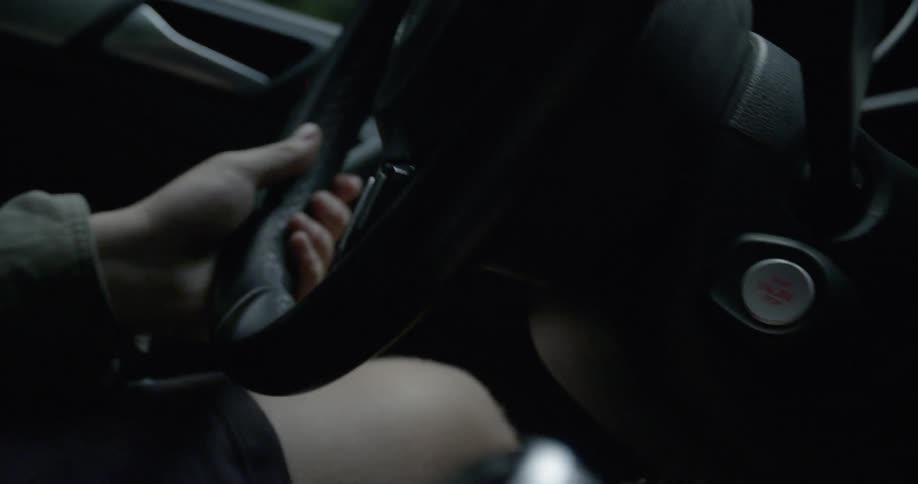 Person jerking the car steering wheel quickly