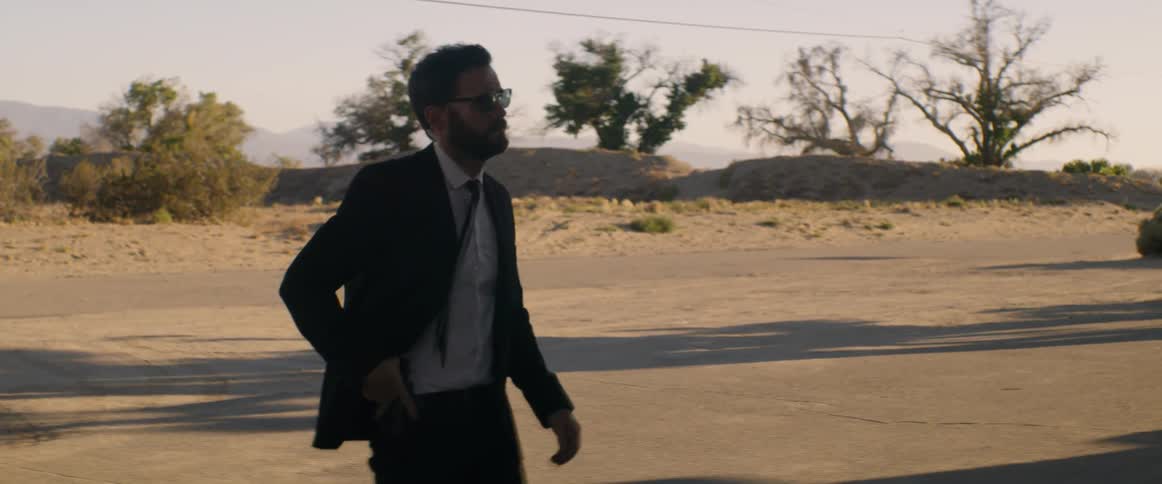 Two men walk from their truck