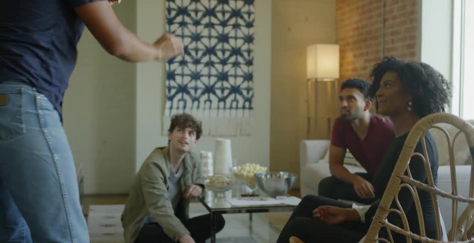 Friends Play Games And Eat Food In Loft