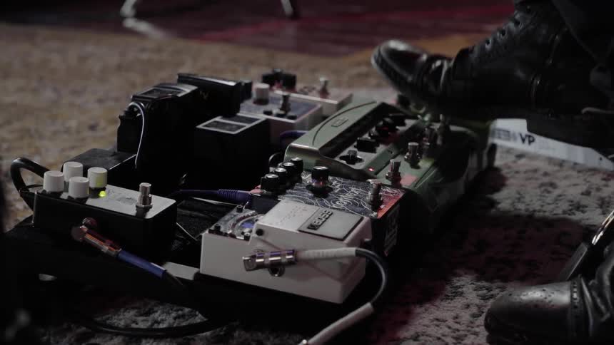 Person taps foot repeatedly on electronics board