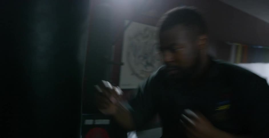 A man punching a boxing bag