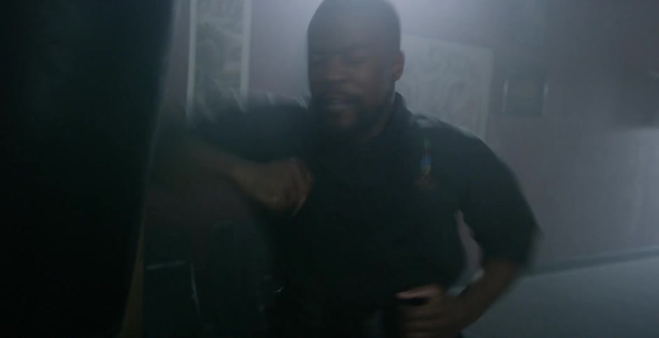 A man punching a boxing bag