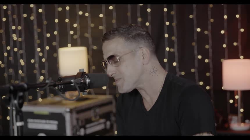 A Man Sings into microphone