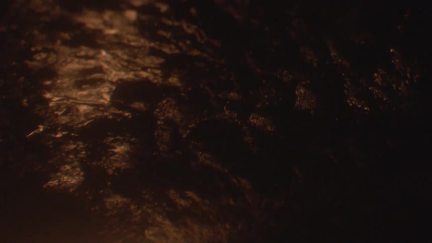 The fire slowly hits the top of the dark wall