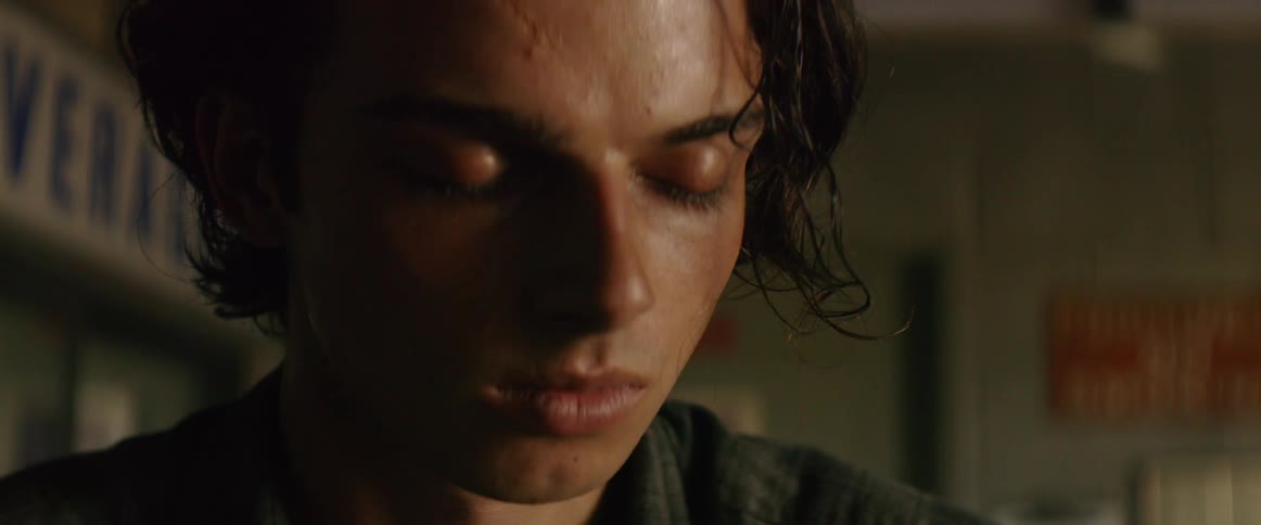 A man sitting with his eyes closed