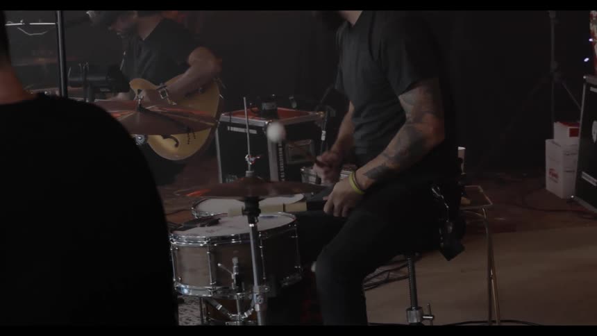 Multiple men playing musical instruments