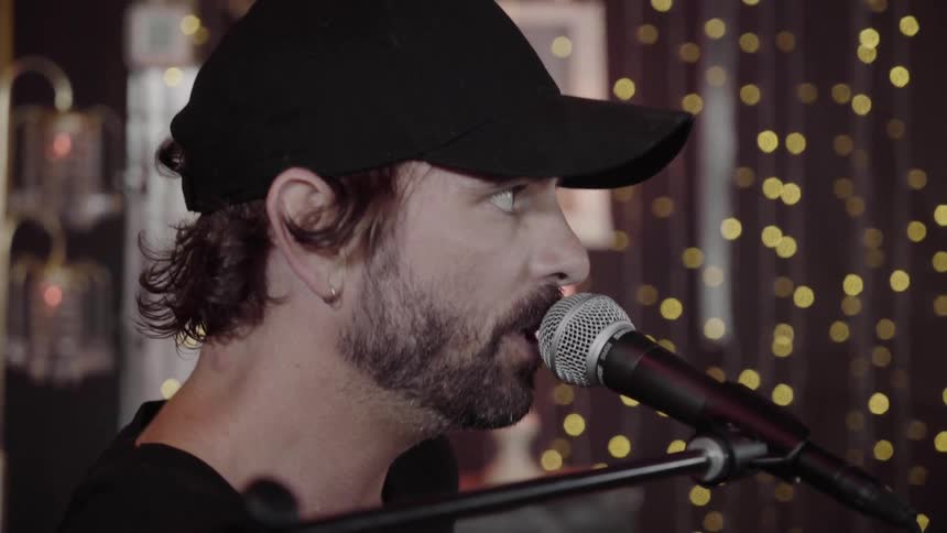 A man singing into a microphone