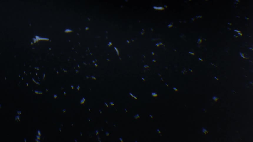 The light is reflecting on the dark liquid