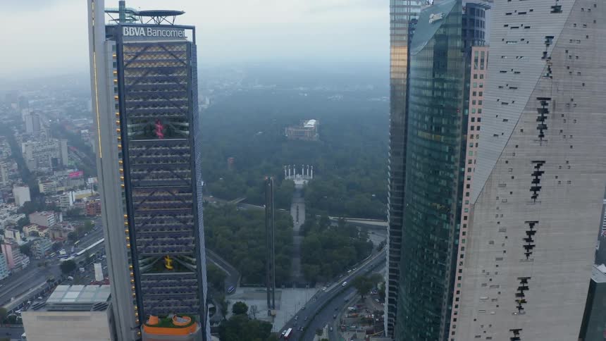 The park by the two towers is covered with fog