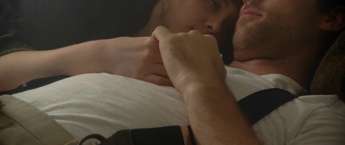 A couple sleep peacefully together during the day