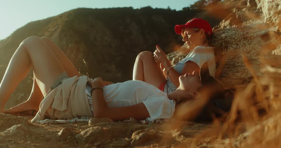 Two women on a sunny hillside